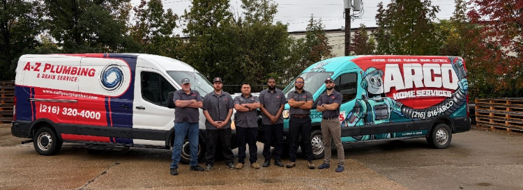 az-plumbing-arco-team A-Z Plumbing and Arco Home Services team standing between their service vans